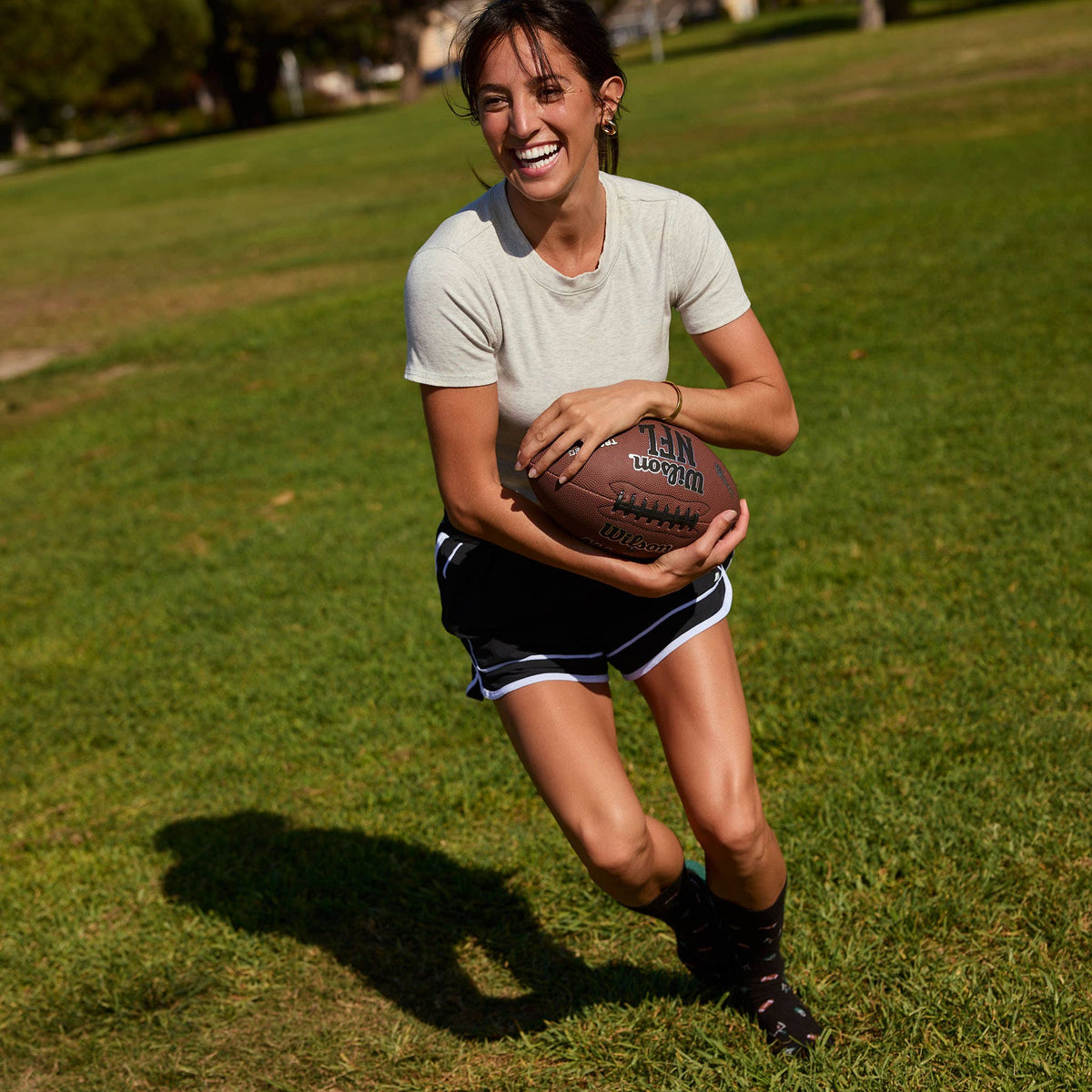 Conscious Step: Socks that Support Youth Sports (Black Footballs)