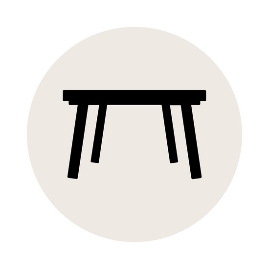 An icon of a table in black and white, with a minimalist design