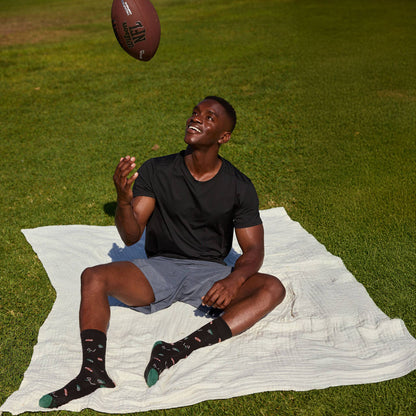 Conscious Step: Socks that Support Youth Sports (Black Footballs)
